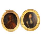 A PAIR OF GEORGIAN OVAL HALF LENGTH PORTRAITS depicting young gentleman 74cm high 62cm wide