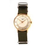 LIP. A GENTLEMAN'S VINTAGE 18CT GOLD WRISTWATCH on green canvas strap, the gold case enclosing a