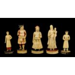 FIVE 19TH CENTURY INDIAN IVORY CHESS PIECES depicting finely carved figures in ceremonial dress