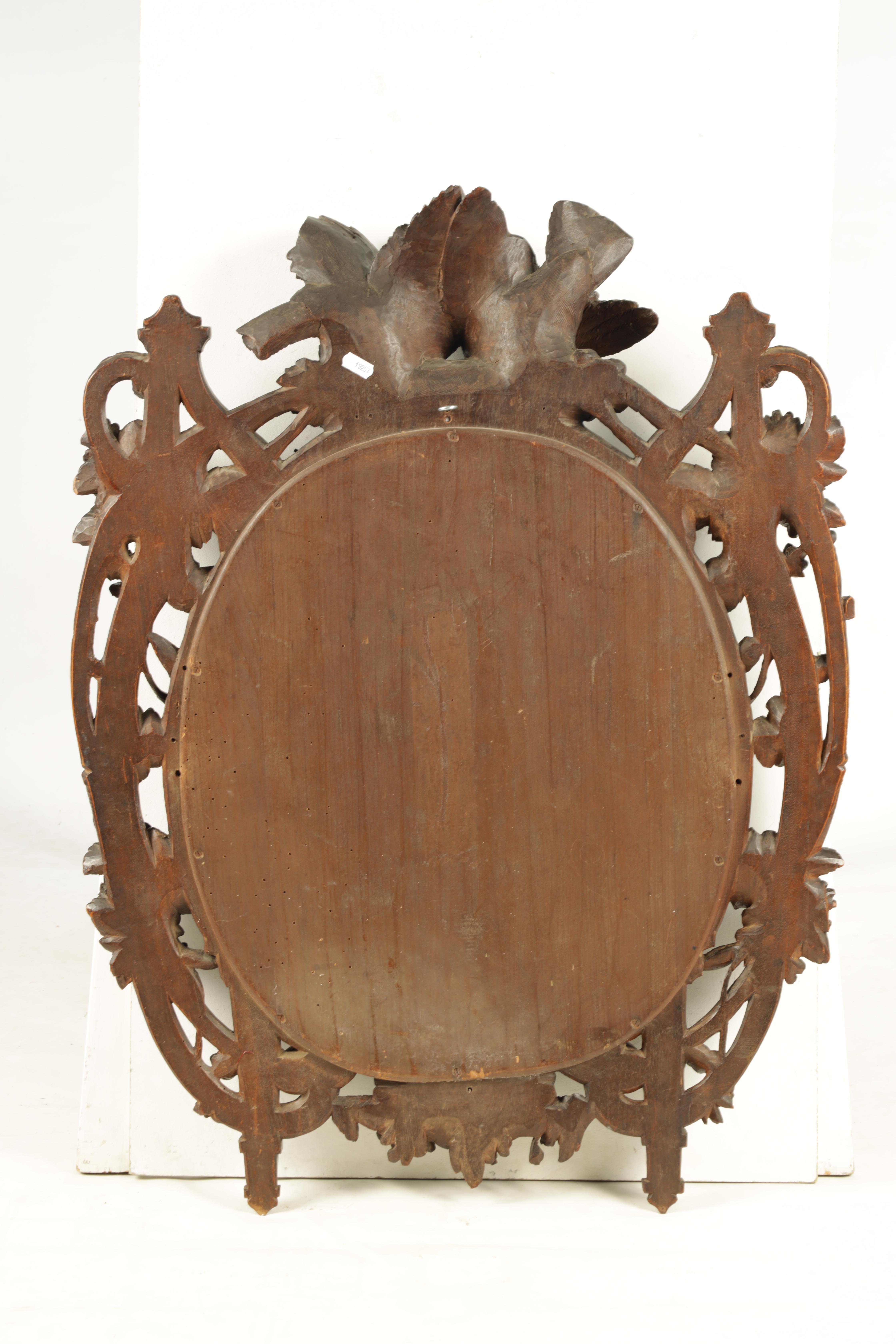 A 19TH CENTURY WALNUT BLACK FOREST CARVED HANGING MIRROR with a pair of doves to the top and a - Image 5 of 5