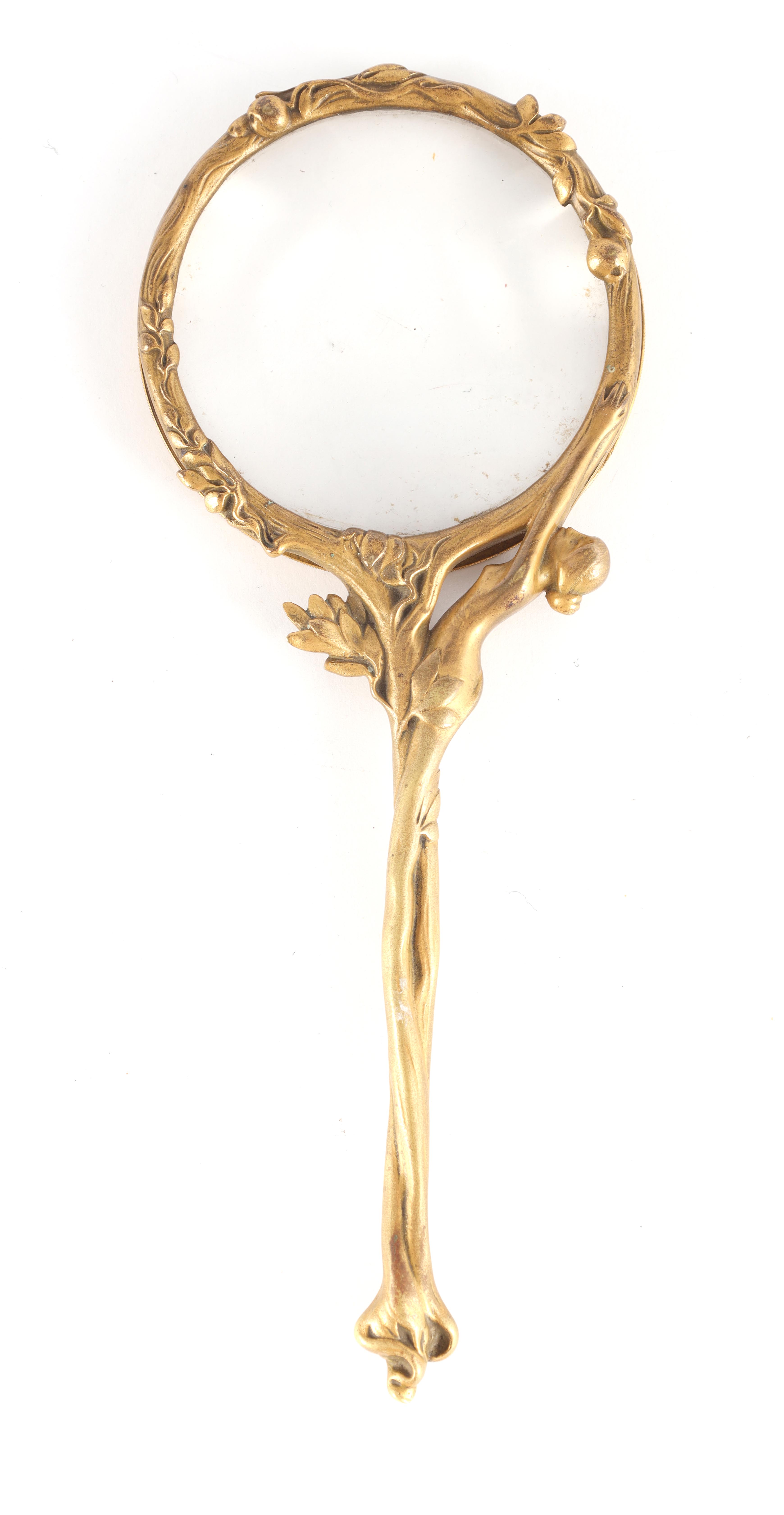 A FRENCH GILT BRONZE ART NOUVEAU MAGNIFYING GLASS the handle decorated with a stylized nude female