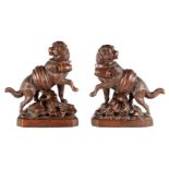 A GOOD QUALITY PAIR OF LATE 19TH CENTURY BLACK FOREST CARVED SCULPTURES modelled as Saint Bernards