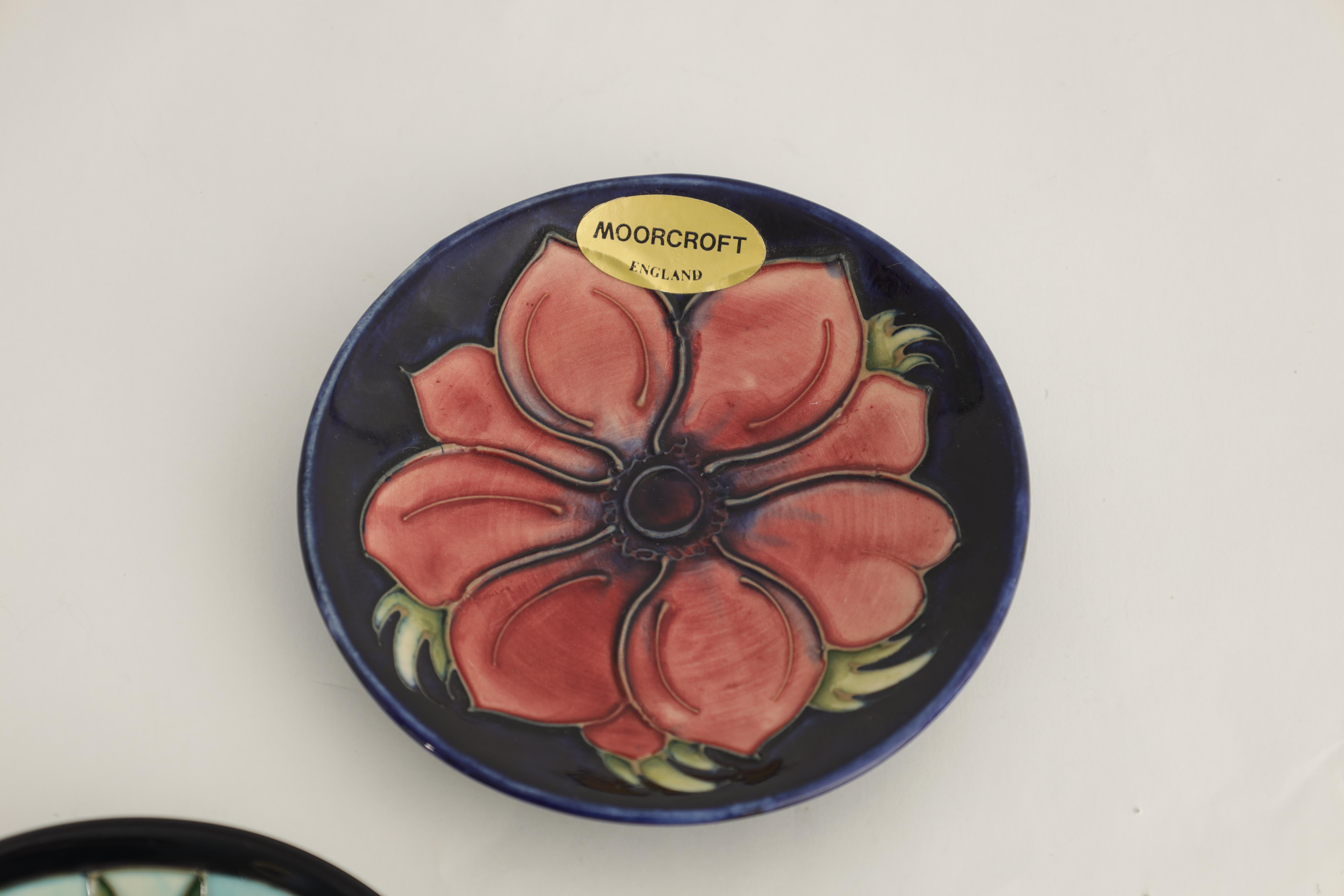 A MOORCROFT DARK BLUE GROUND PIN TRAY tube lined and decorated with a large water lily flowerhead - Image 2 of 7