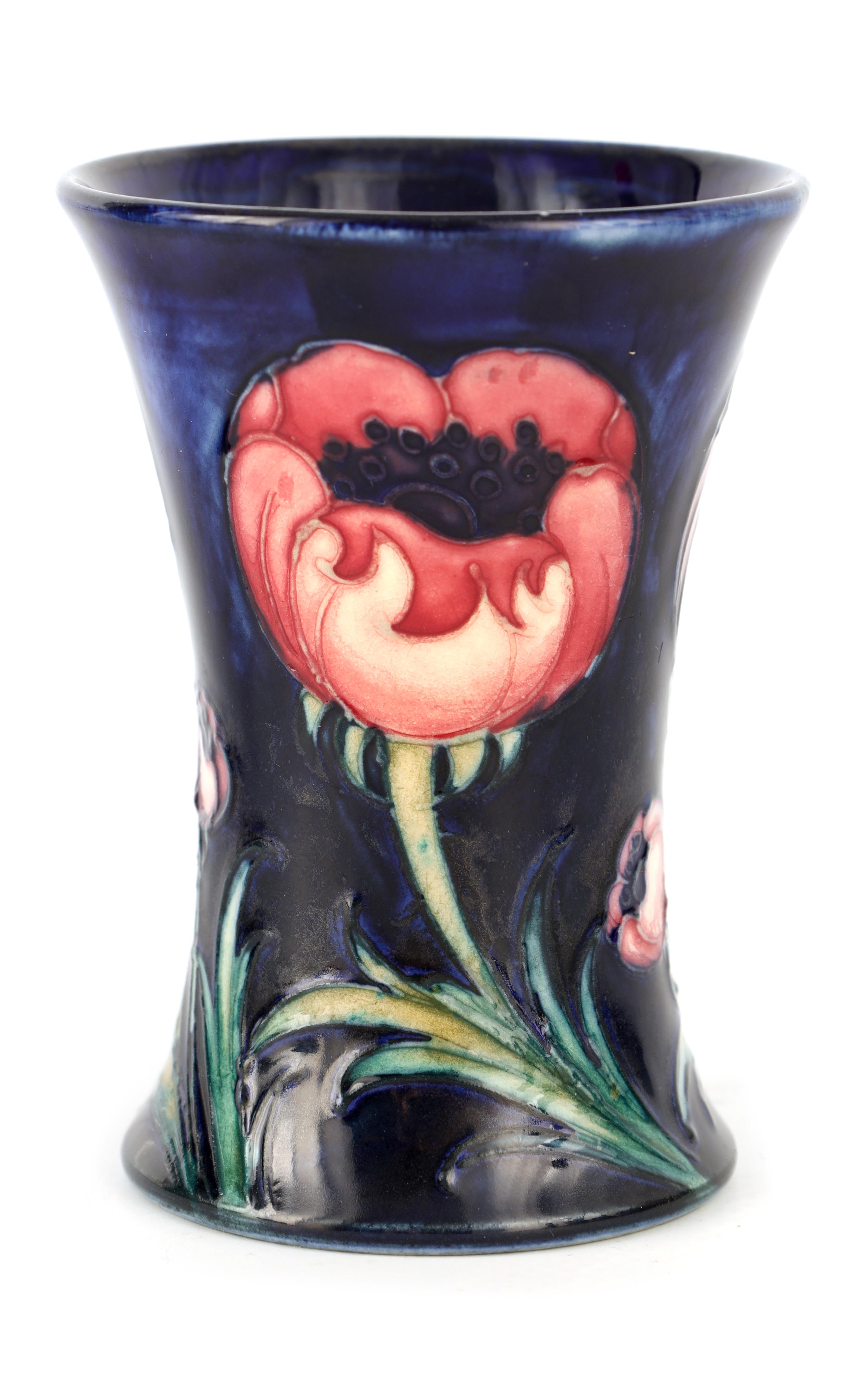 A 1920S MOORCROFT FLARED MINIATURE VASE tube lined and decorated in the Poppy pattern on a mottled