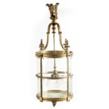 A LARGE REGENCY GILT BRASS HANGING LANTERN with leaf cast circular frame fitted with bevelled