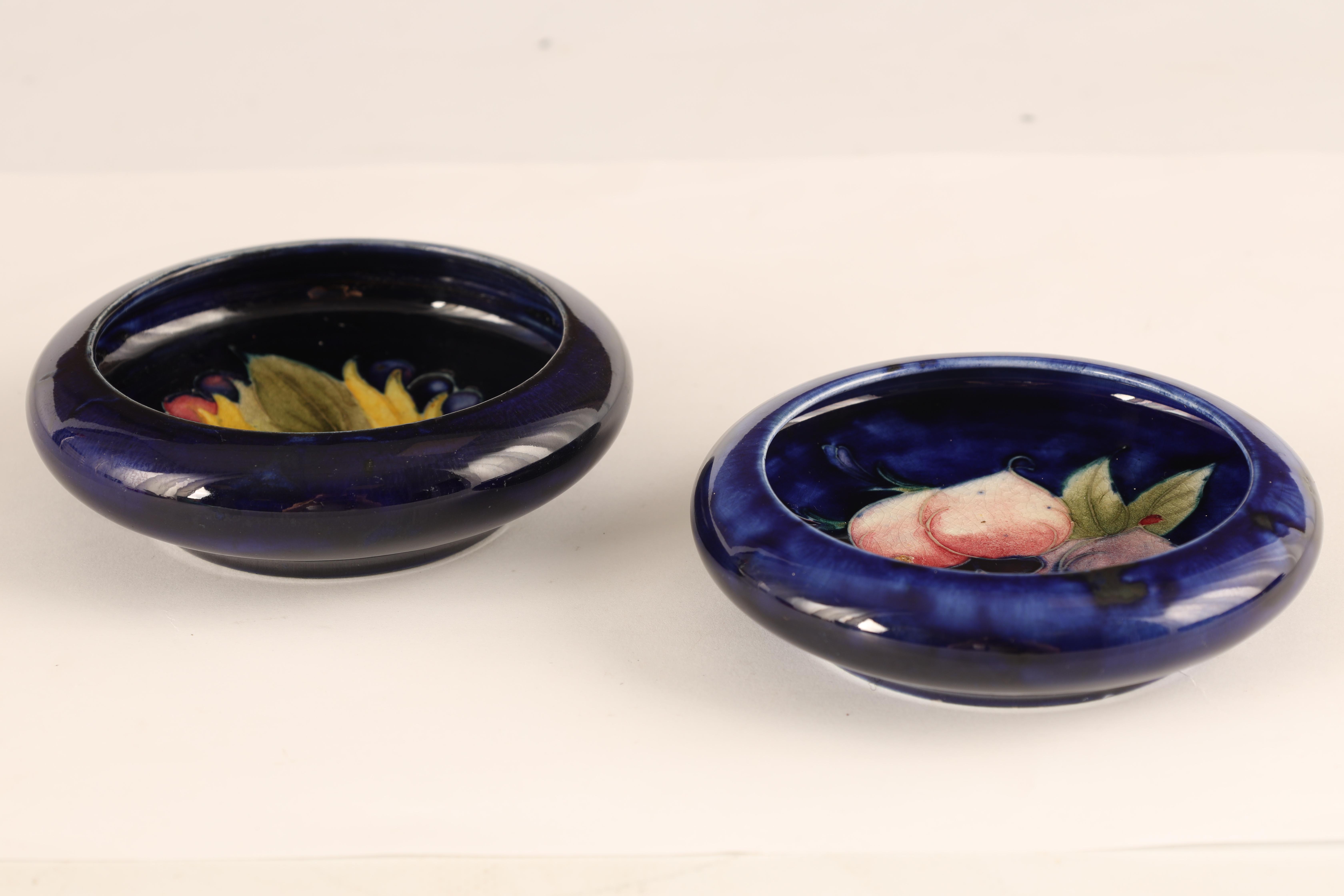 TWO MOORCROFT SHALLOW SMALL DISHES WITH CURVED RIMS decorated in the Leaf and Berry and Plum pattern - Image 4 of 5