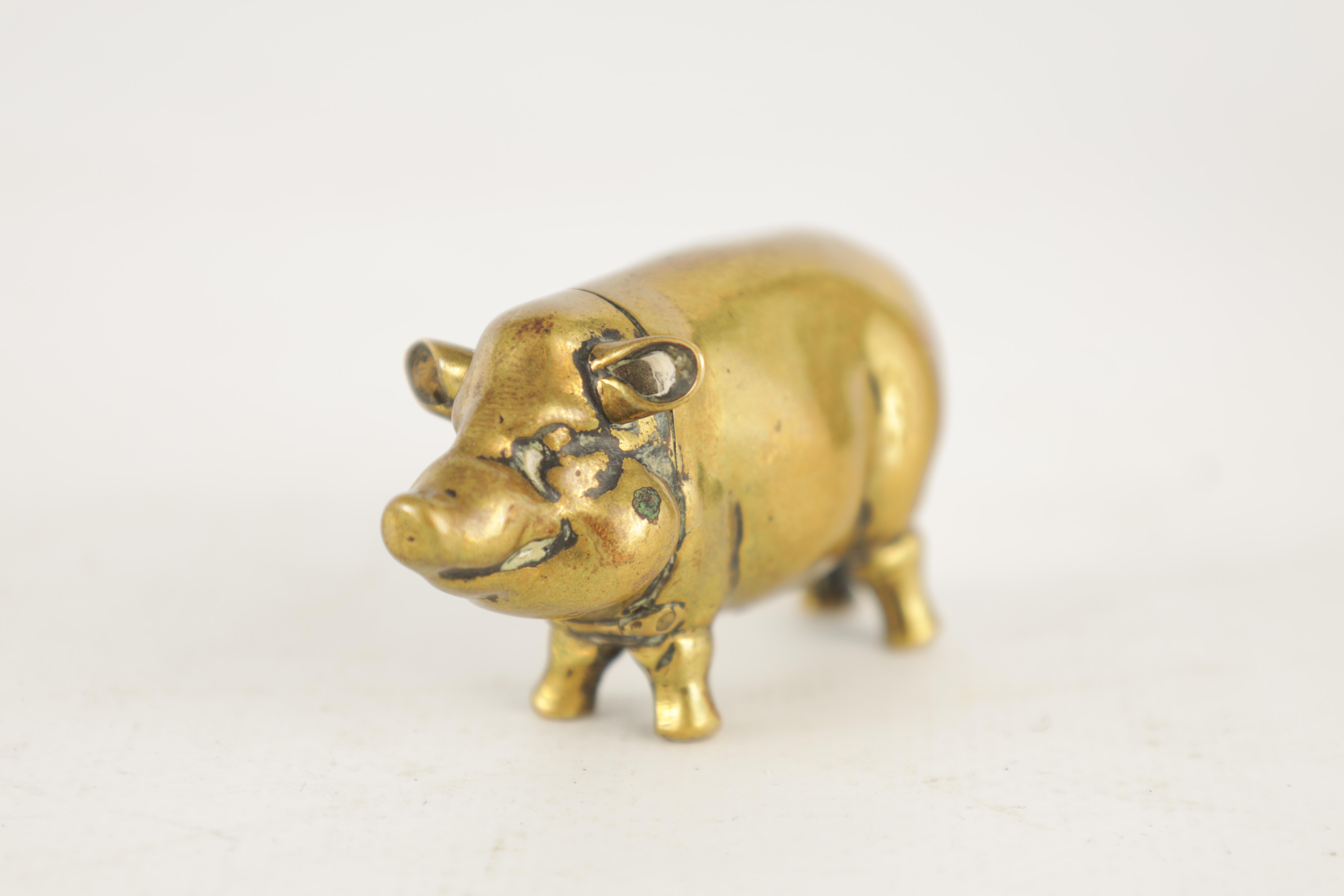 A 19TH CENTURY BRASS VESTA CASE FORMED AS A PIG with hinged head and striker to the belly 6cm wide - Image 2 of 6