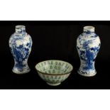 A PAIR OF 19TH CENTURY CHINESE BLUE AND WHITE VASES decorated with blossoming trees and birds 17cm