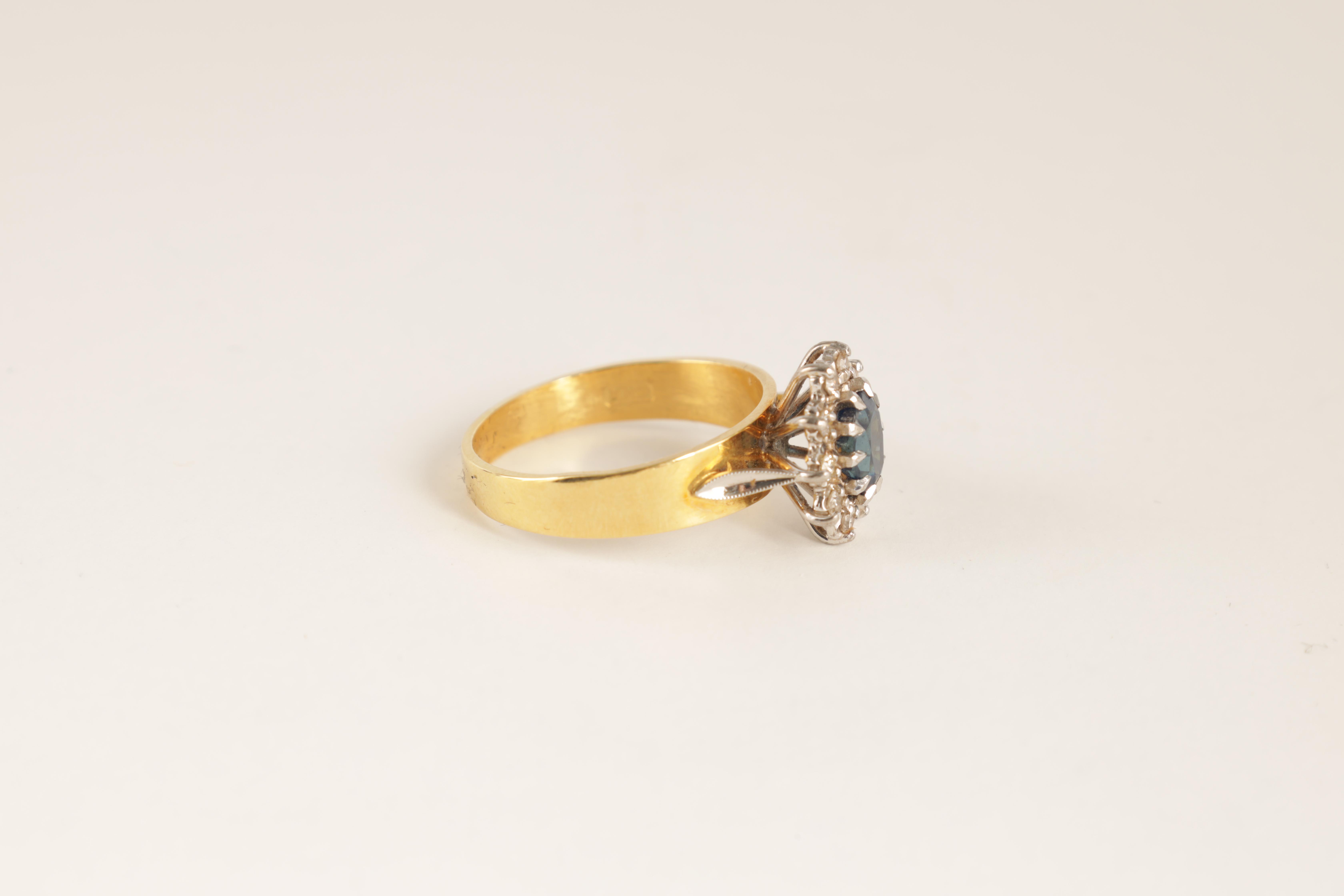 A LADIES 14CT GOLD DIAMOND AND SAPPHIRE RING with oval cut centre stone enclosed by 10 brilliant-cut - Image 3 of 6