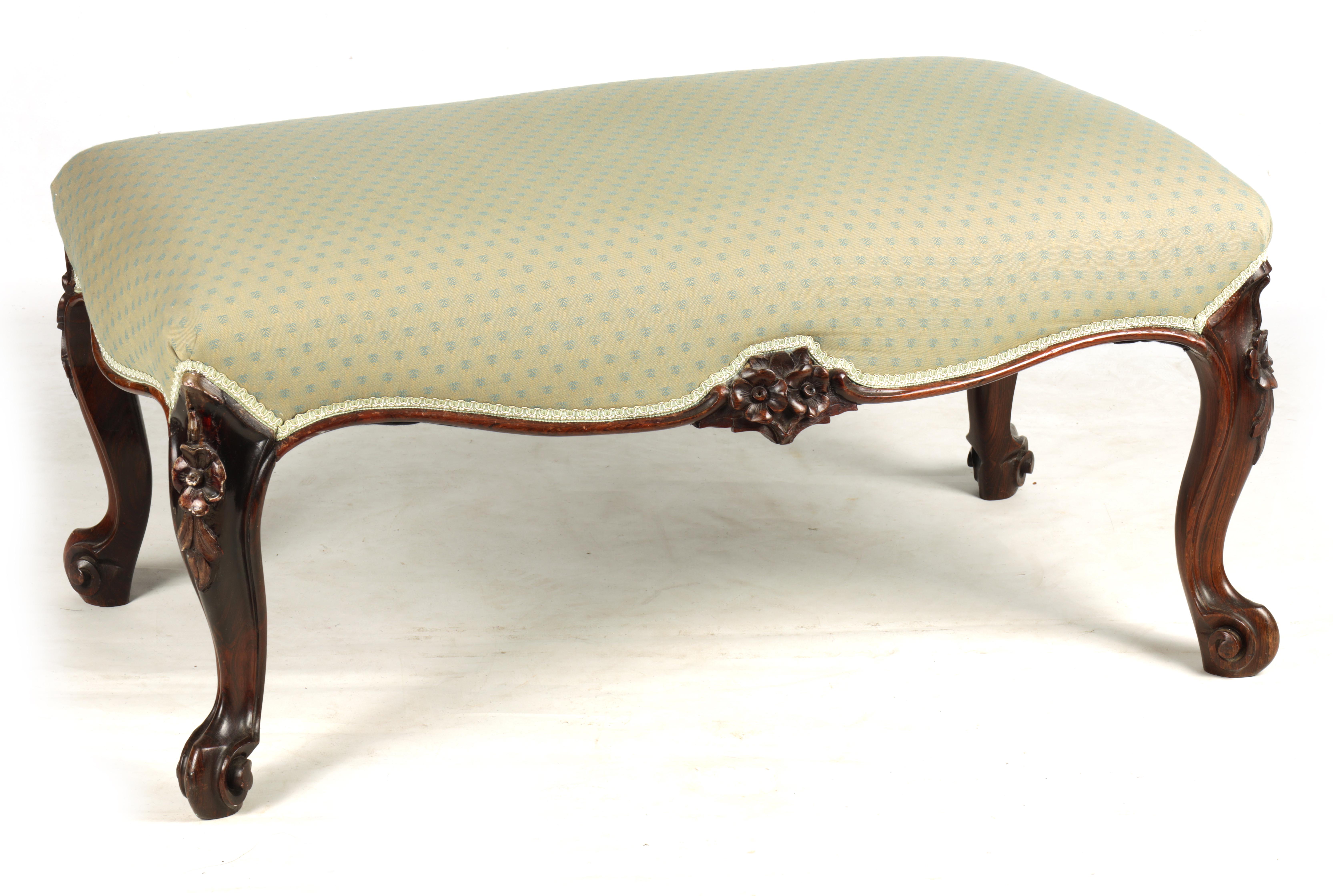 A MID 19TH CENTURY ROSEWOOD DRESSING STOOL of serpentine outline having an upholstered seat with