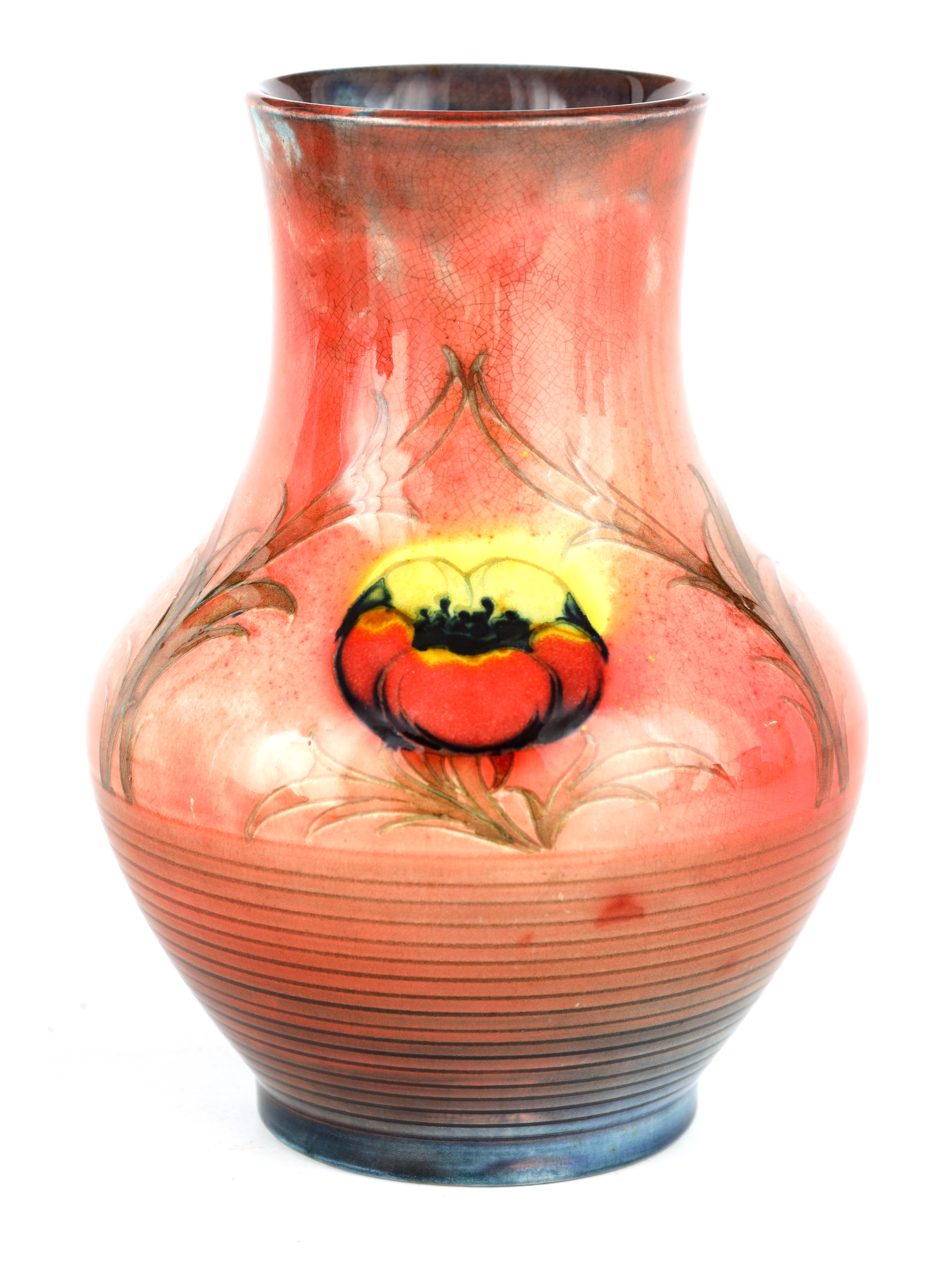 AN UNUSUAL 1930S MOORCROFT BULBOUS VASE with ribbed lower body beneath tube lined panels of