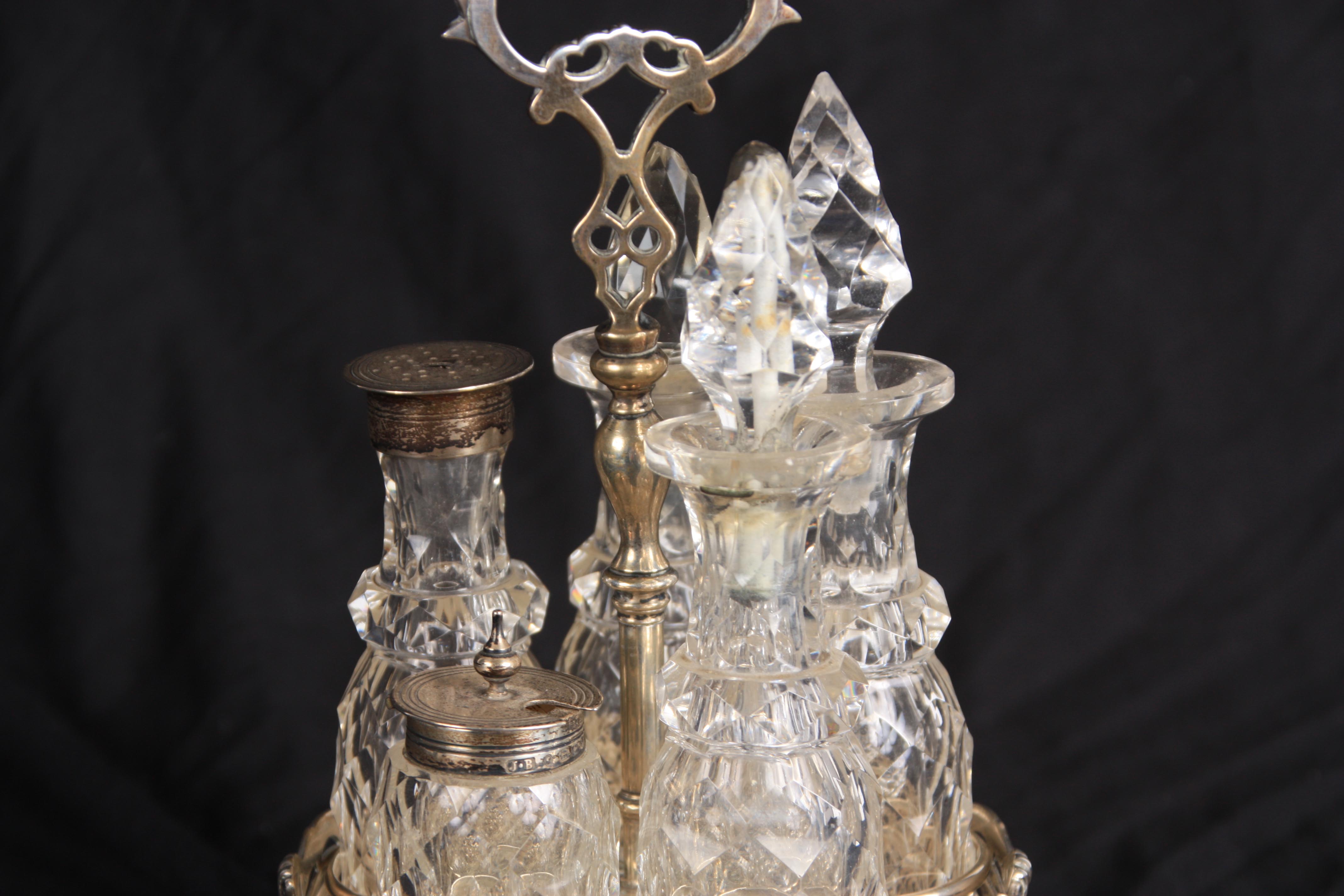 AN EARLY VICTORIAN SILVER 5 BOTTLE CRUET FRAME with shaped pierced handle, turned stem with - Image 9 of 14