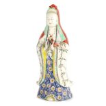 AN EARLY 19TH CENTURY CHINESE PORCELAIN GUANYIN with coloured dress 34cm high