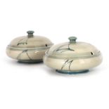 A PAIR OF MOORCROFT LIDDED TABLE TUREENS decorated in the Yacht pattern on a celadon ground, 19.