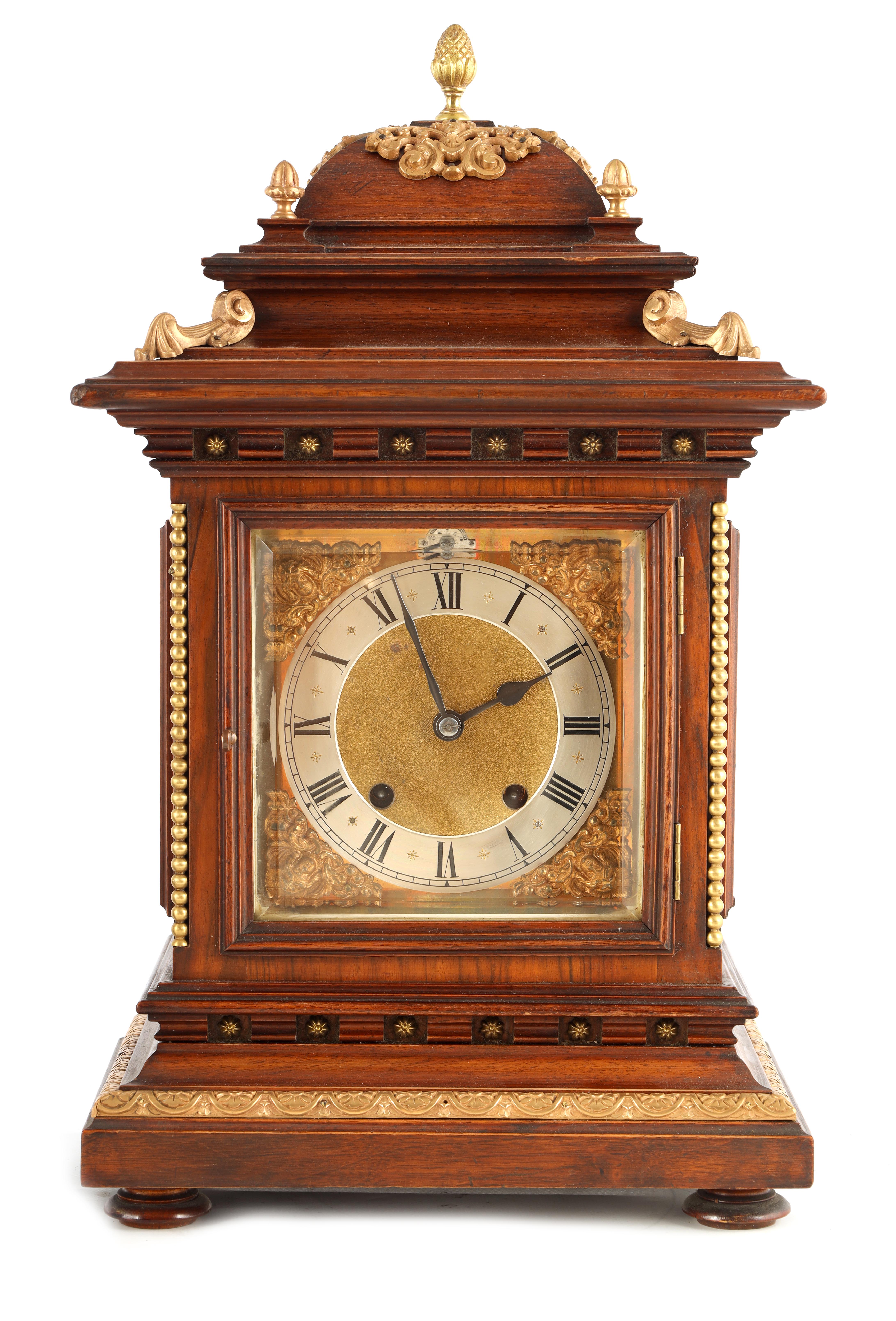 A LATE 19TH CENTURY GERMAN WALNUT ORMOLU MOUNTED BRACKET CLOCK the 6.5" square brass dial with