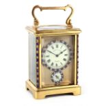 AN EARLY 20TH CENTURY FRENCH TIMEPIECE ALARM CARRIAGE CLOCK the brass case with applied paste blue