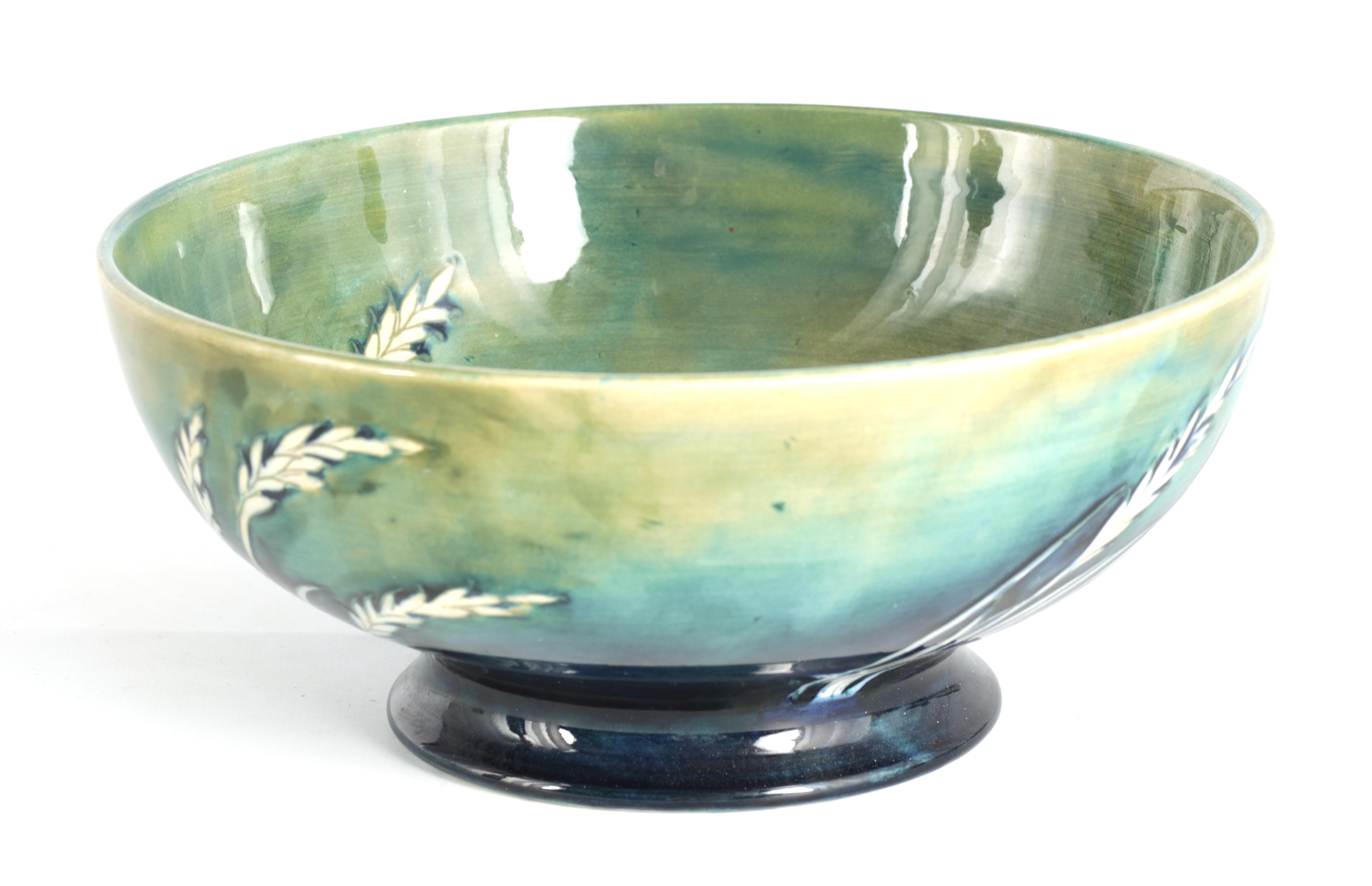 A 1930S/40S MOORCROFT FOOTED LARGE BOWL decorated in the waving corn pattern on a mottled blue