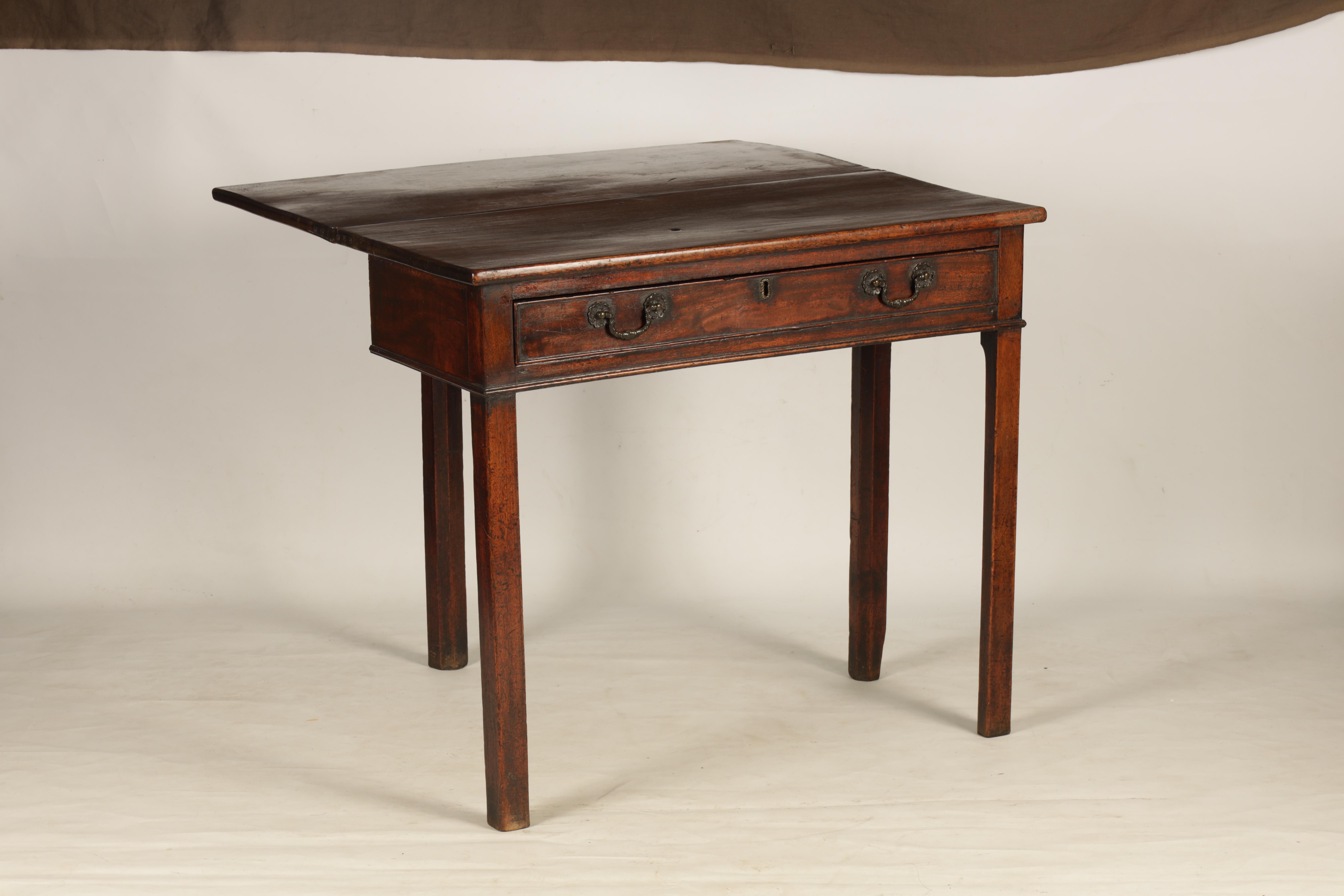 A GEORGE III MAHOGANY TEA TABLE with fold over top above a frieze drawer; standing on square - Image 4 of 6