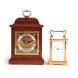 TWO 20TH CENTURY CLOCKS BY GARRARD, LONDON the first having a burr walnut case with brass dial and