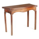 A GEORGE III MAHOGANY CHIPPENDALE STYLE SERPENTINE TEA TABLE with hinged top and swing-out back leg;