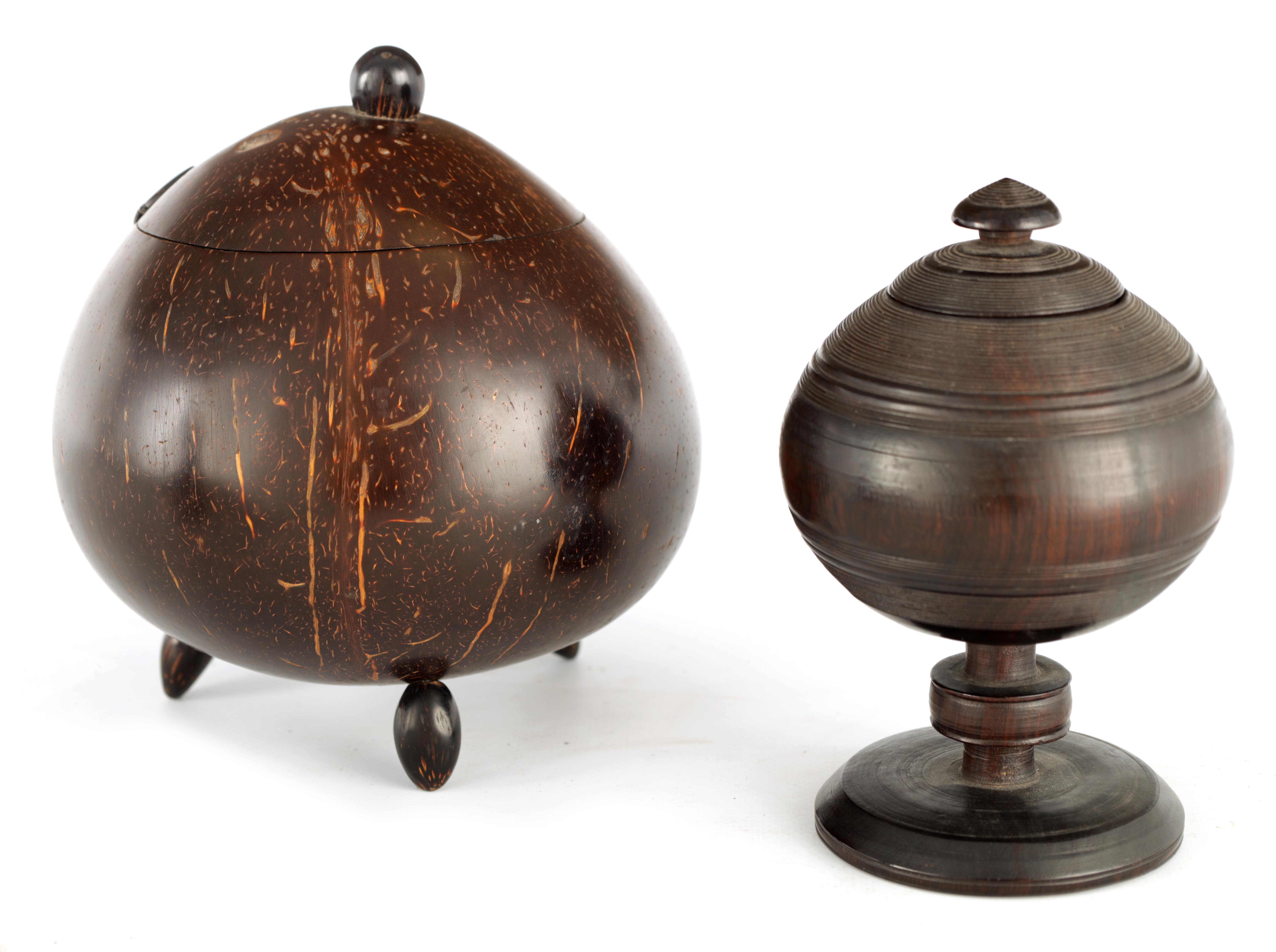 AN 18TH CENTURY LIGNUM VITAE TURNED LIDDED JAR with circular foot and knopped pedestal stem