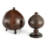 AN 18TH CENTURY LIGNUM VITAE TURNED LIDDED JAR with circular foot and knopped pedestal stem