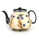 AN EARLY MACINTYRE BURSLEM LARGE TEAPOT WITH ROUNDED TAPERING BODY decorated with overall sprays