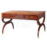 A STYLISH REGENCY STYLE ROSEWOOD LIBRARY DESK with tan tooled leather top above a shallow frieze