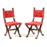 A PAIR OF 19TH CENTURY MAHOGANY HALL CHAIRS with lions mask carved tops above upholstered backs;