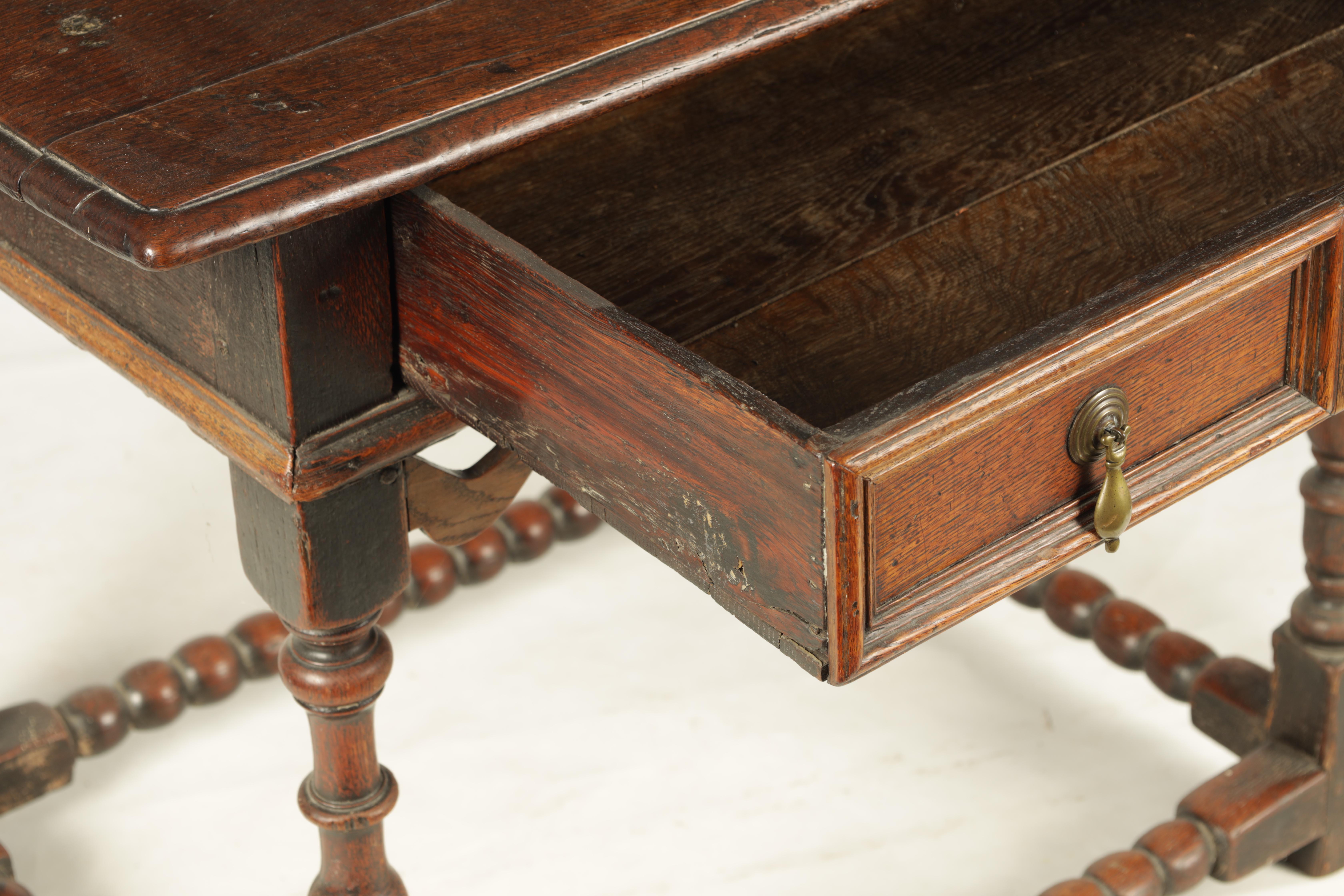 A 17TH CENTURY JOINED OAK SIDE TABLE with panelled frieze drawer and shaped pierced corner blocks; - Image 5 of 8