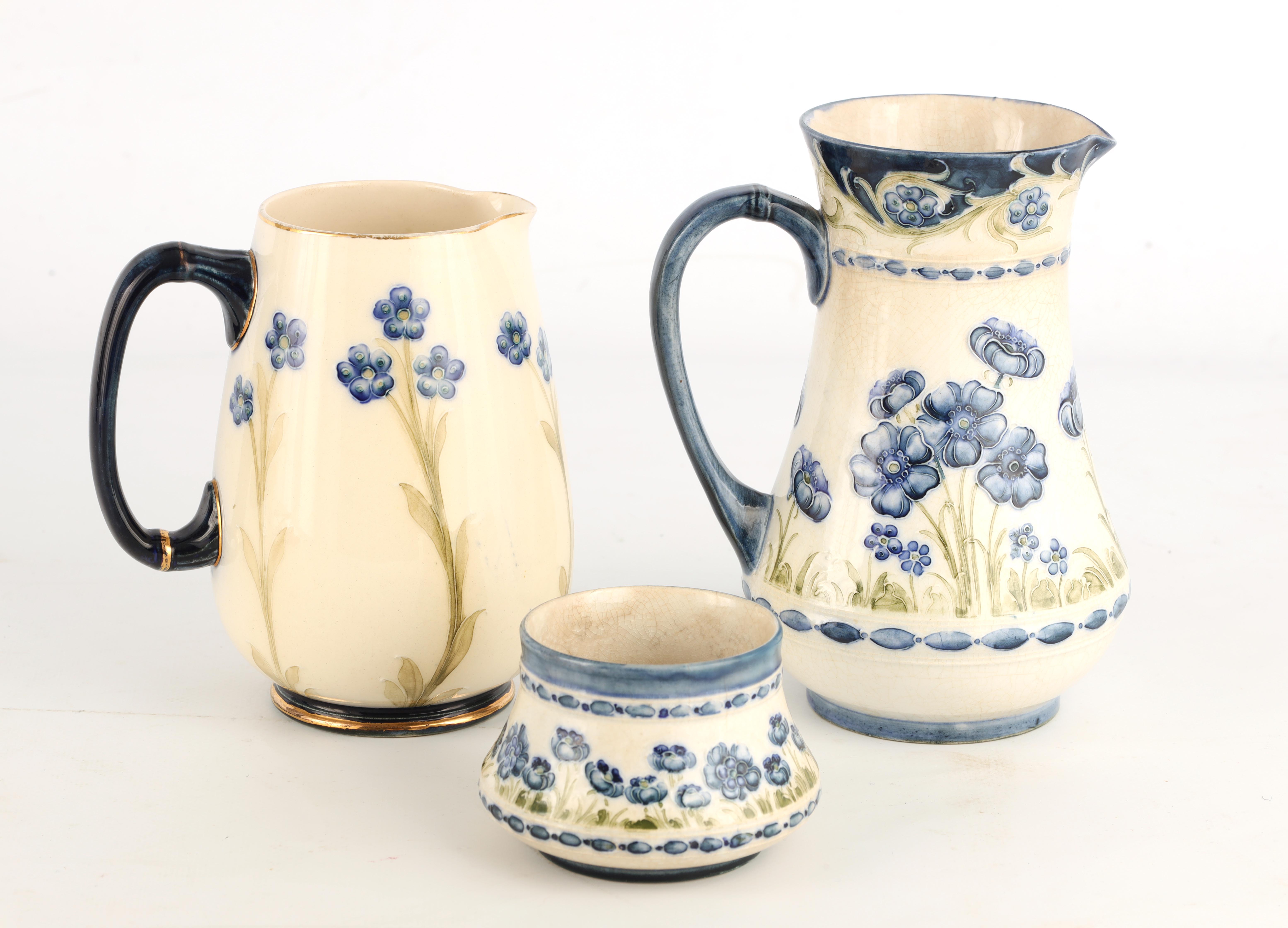 A JAMES MACINTYRE AND CO BURSLEM BULBOUS JUG tube lined and decorated in the blue poppy pattern