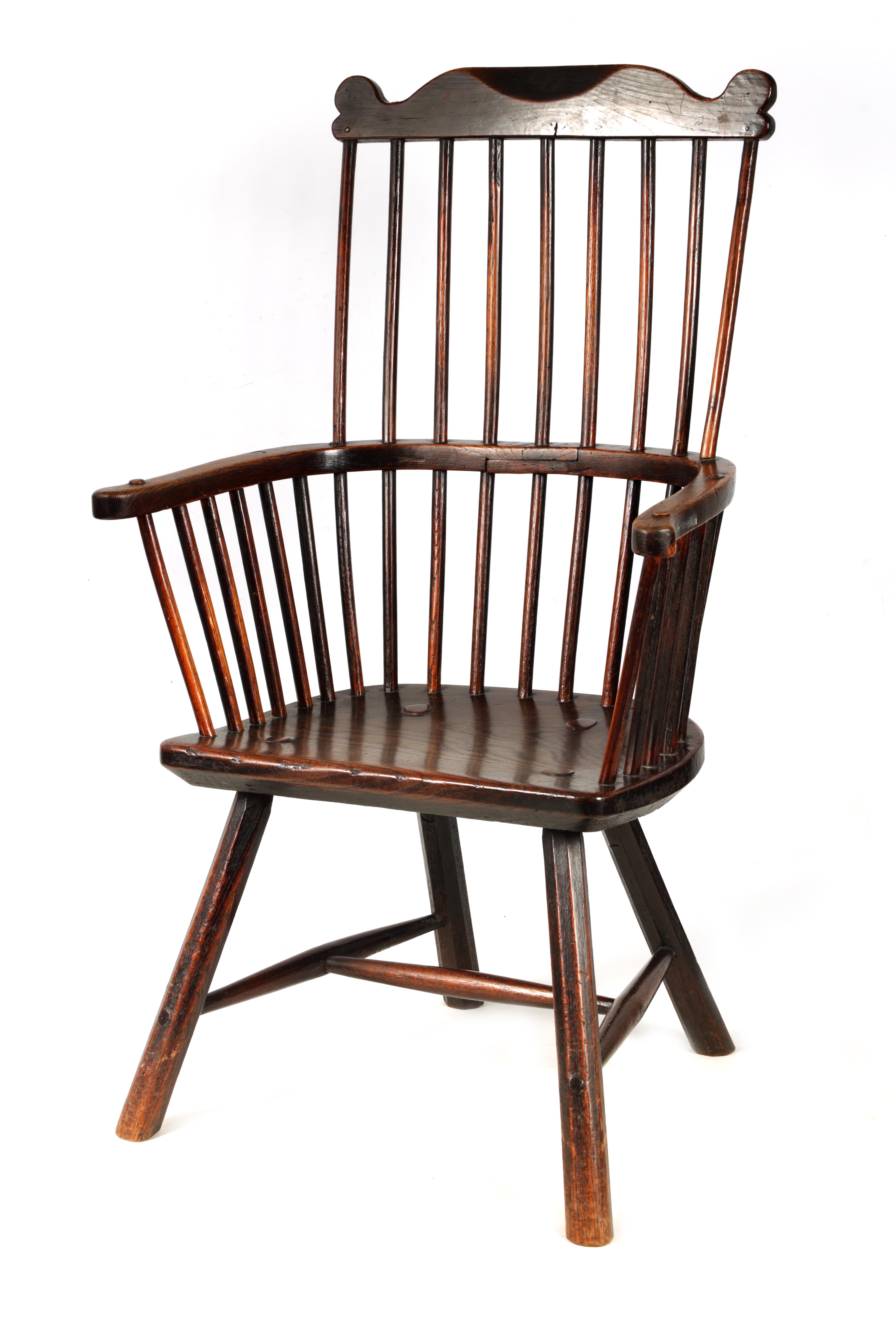 A GOOD 18TH CENTURY THAMES VALLEY OAK AND ELM WINDSOR CHAIR with shaped top rail and flared arms,