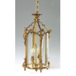 A 20TH CENTURY REGENCY STYLE HANGING HALL LANTERN OF SERPENTINE SHAPE