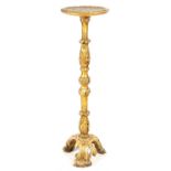 AN EARLY 18TH CENTURY CARVED GILT GESSO TORCHERE