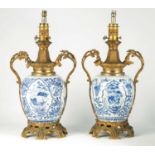 A LARGE MATCHED PAIR OF 18TH CHINESE BLUE AND WHITE GINGER JARS, LATER CONVERTED TO LAMPS