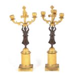 A PAIR OF REGENCY FIGURAL BRONZE AND ORMOLU CANDELABRA