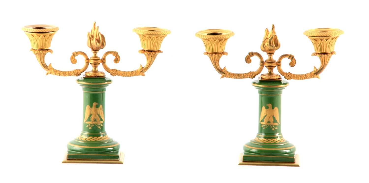 A PAIR OF 19TH CENTURY FRENCH NAPOLEON PORCELAIN AND ORMOLU MOUNTED TWO BRANCH CANDELABRA