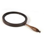 A GEORGE III CONCAVE MAGNIFYING HAND MIRROR