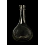 A LARGE GEORGIAN BULBOUS CLEAR GLASS WINE CARAFE