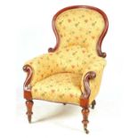 A VICTORIAN MAHOGANY UPHOLSTERED ARMCHAIR