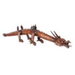A JAPANESE MEIJI PERIOD ARTICULATED WOOD DRAGON