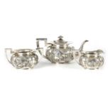 AN EARLY 20TH CENTURY CHINESE SILVER THREE PIECE TEA SERVICE