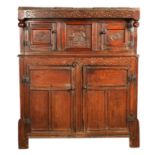 A 17TH CENTURY CARVED OAK DUDARN/COURT CUPBOARD OF SMALL SIZE