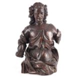 A 17TH/18TH CENTURY CARVED FRUITWOOD FIGURE