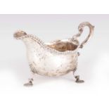 AN EARLY GEORGE III SILVER SAUCE BOAT