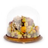 A 19TH CENTURY DOME SHAPED GLASS DOME DECORATED WITH PORCELAIN FRUITS