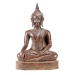 A LARGE TIBETAN PATINATED BRONZE BUDDHA