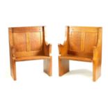 A PAIR OF MID 20TH CENTURY ROBERT 'MOUSEMAN' THOMPSON 'CORONATION' OAK HALL BENCHES