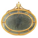 A 19TH CENTURY GILT GESSO ADAM STYLE OVAL HANGING MIRROR