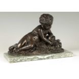 A 19TH CENTURY BRONZE SCULPTURE OF A SEATED CHERUB HOLDING A BUTTERFLY